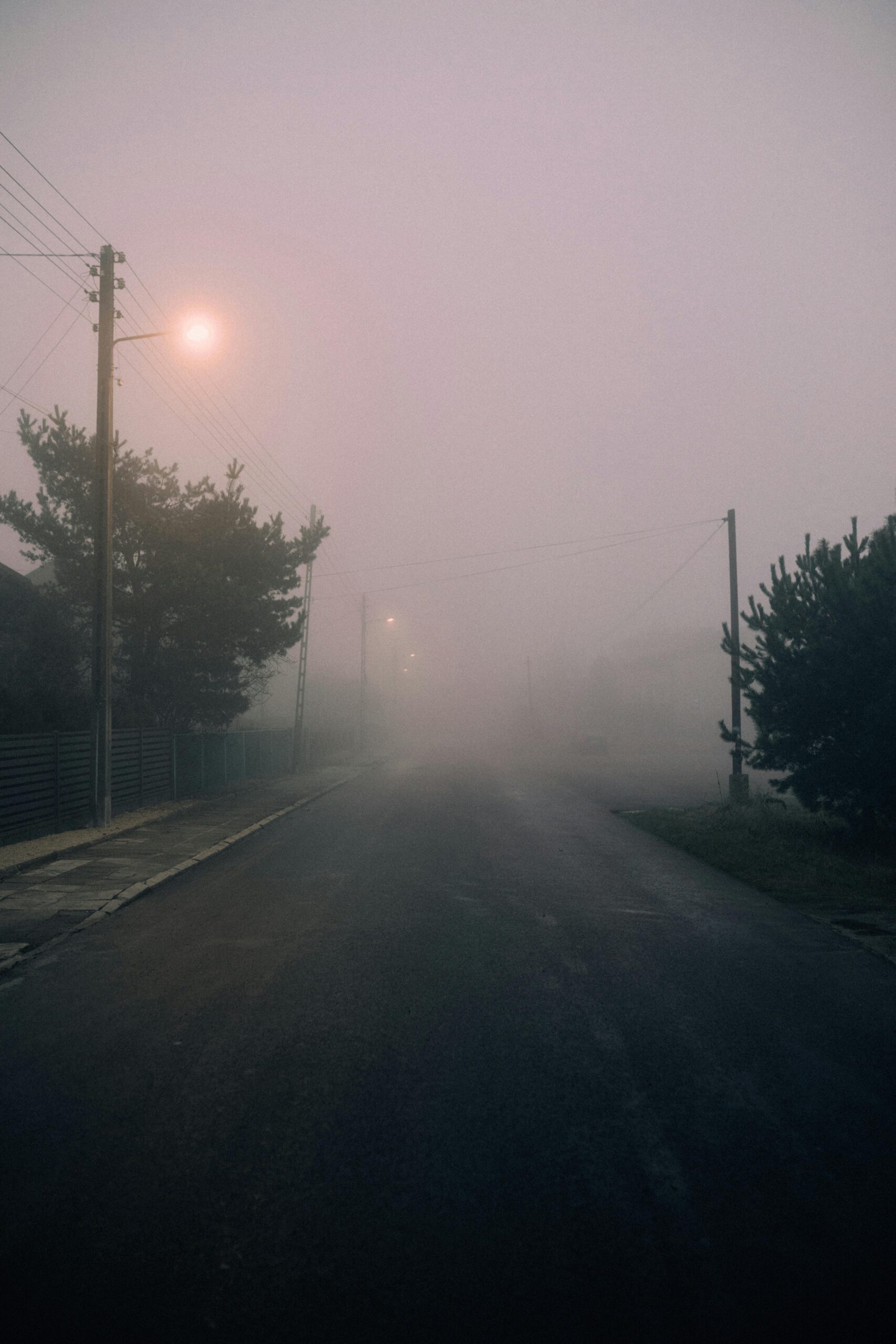 Foggy street with lamp posts at night - the most common mistake new hires make walking into the unknown